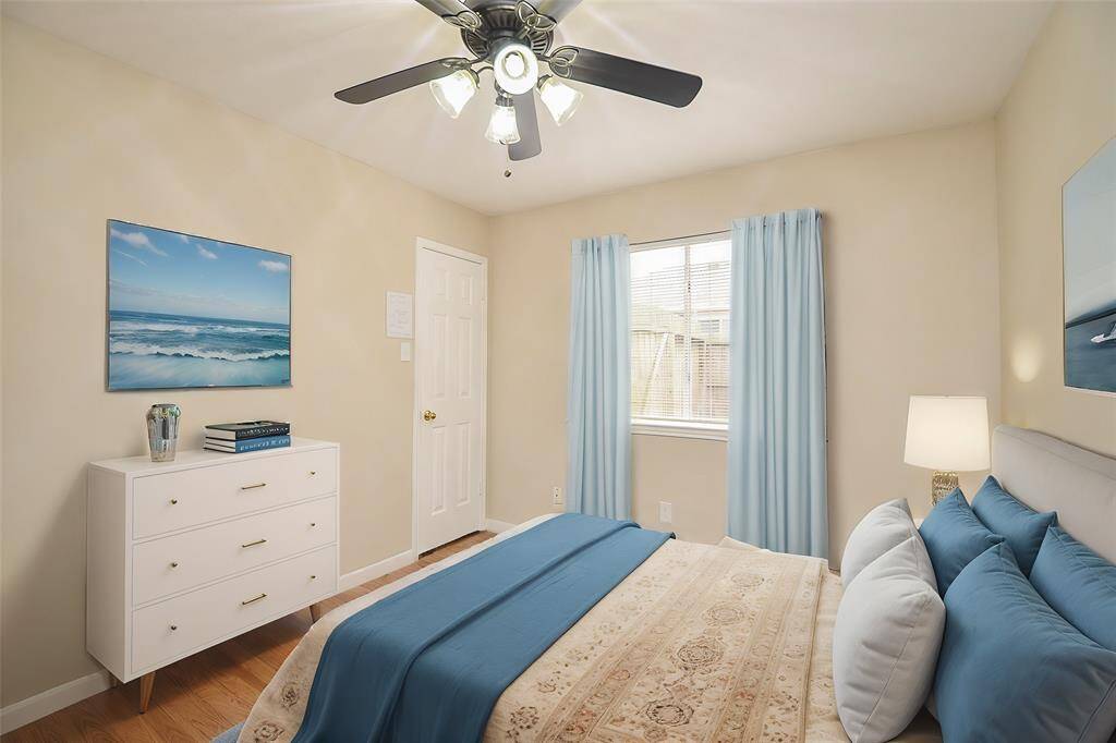 This bedroom has double windows that look out to the side yard and also has a walk-in closet.