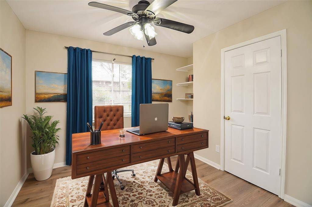 This 3rd secondary bedroom has built-in shelving and a closet. The double windows let in plenty of natural light; this room could also make a great study or workout room!