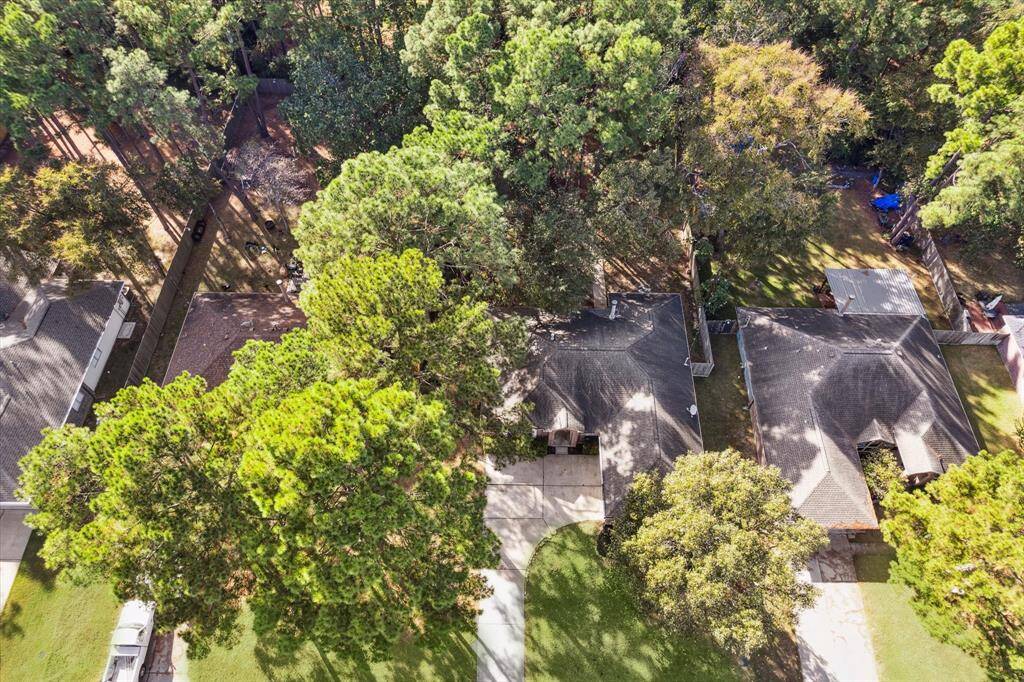 This aerial view highlights the privacy and spaciousness of the lot.
