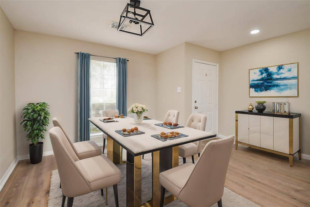 As you step inside, you're greeted by warm, natural tones throughout the home. To the right of the foyer, you'll find a formal dining room that can also serve as a versatile office space.