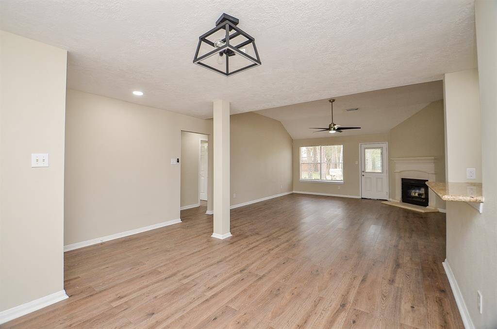 Another view of this room shows the hallway leading to the secondary bedrooms just off the entry to the left.
