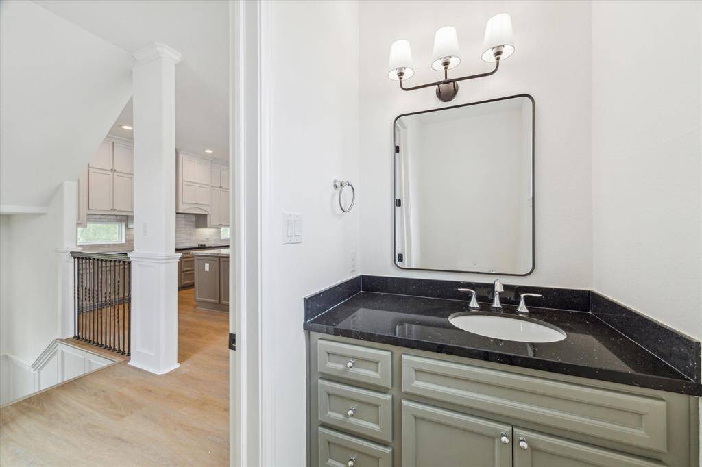 A powder bath on the main floor has its own modern charm.
