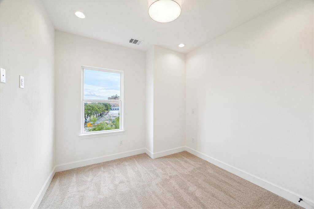 Two secondary bedrooms on the third floor - each with new lighting and carpet.