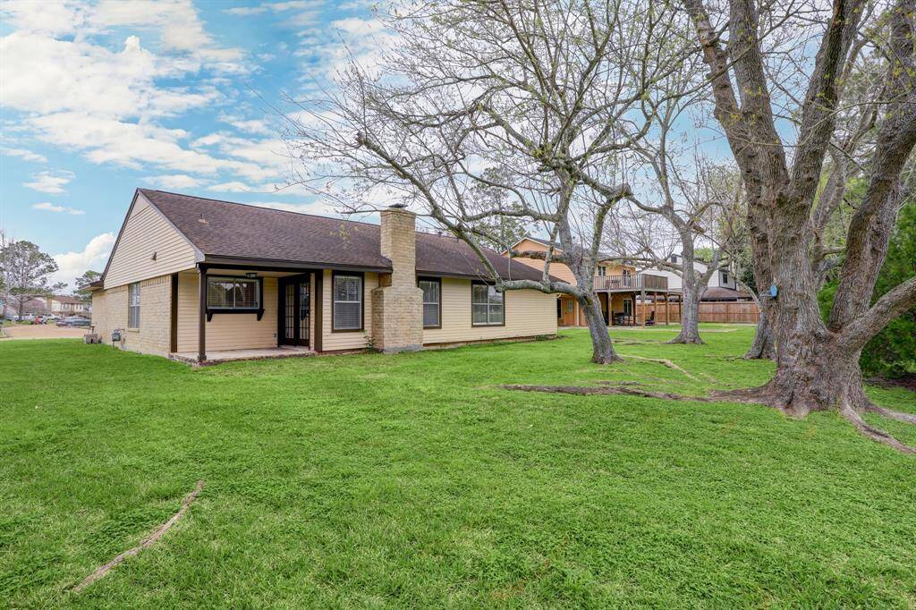 Sitting on a green space that was once a golf course, the backyard appears much larger than the already spacious 9,000 sqft lot due to the extra green space.  Even though it is secluded with mature trees, the walking path is still easily accessible.