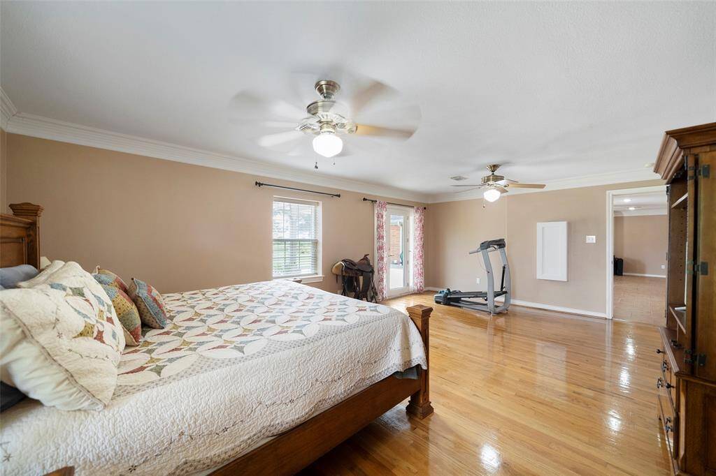 This oversized retreat includes ceiling fans, generous layout flexibility, and easy flow to the living area—ideal for comfort and convenience.