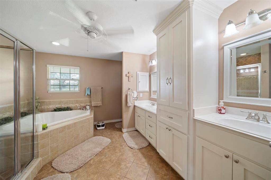 Enjoy a relaxing ensuite bath with double vanities, ample storage, and tasteful finishes throughout.