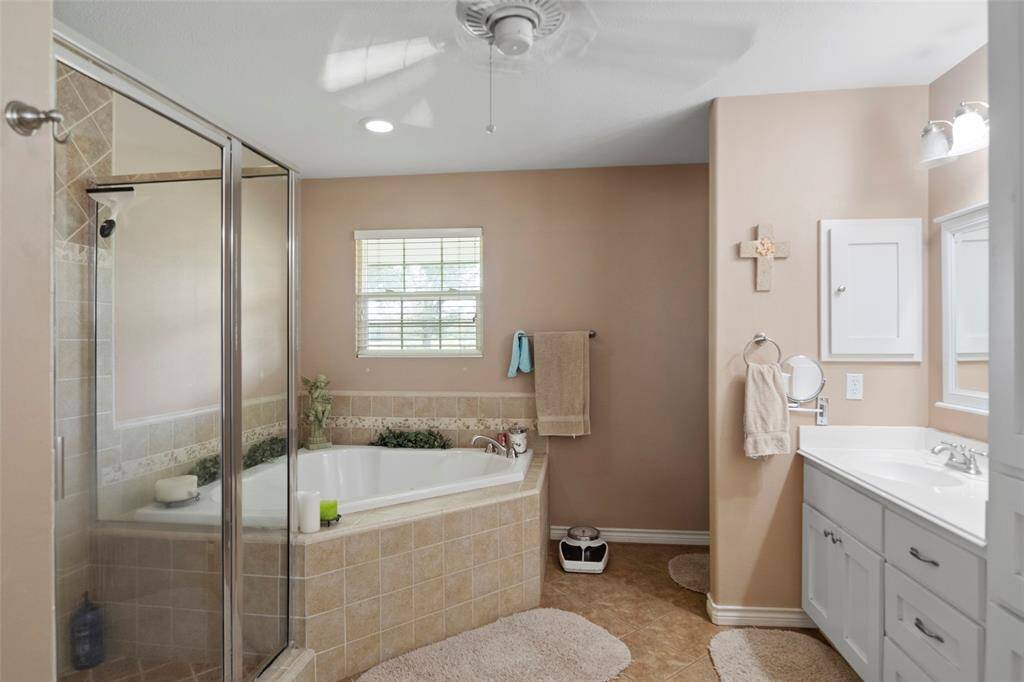 Unwind in the jetted soaking tub or refresh in the walk-in shower—your own private spa experience at home.