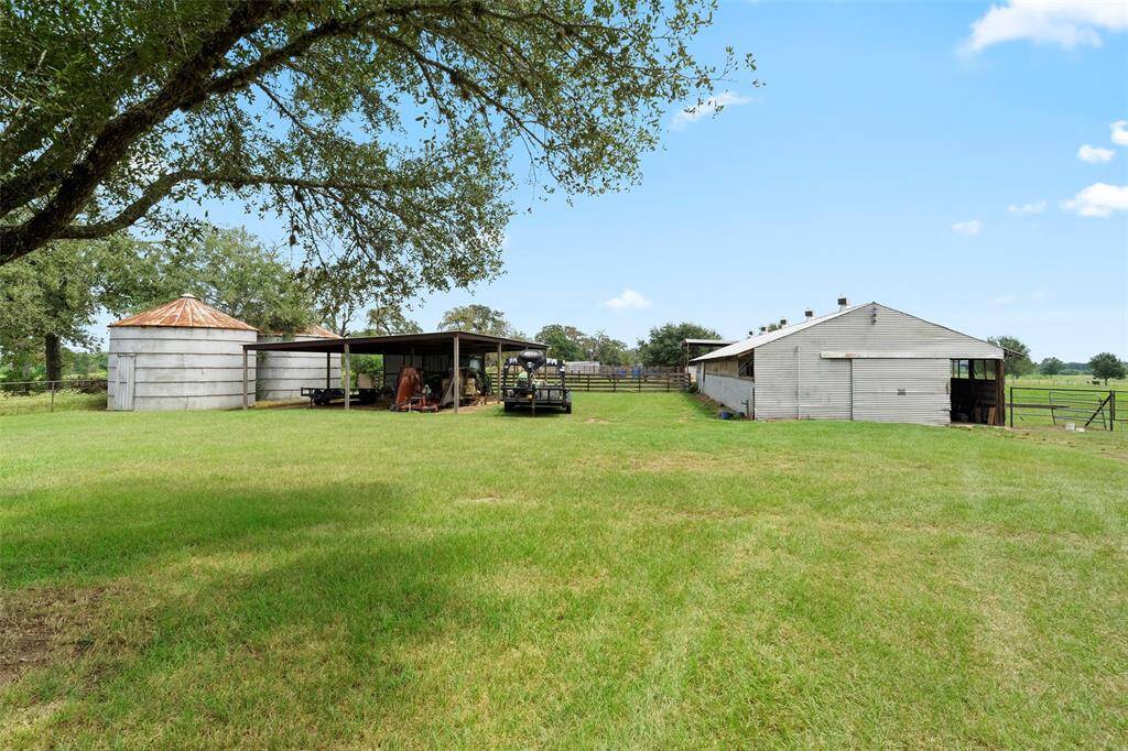 Multiple barns and covered structures provide ample space for equipment storage, livestock shelter, and hay — ideal for tenants planning to maintain up to 3 horses.