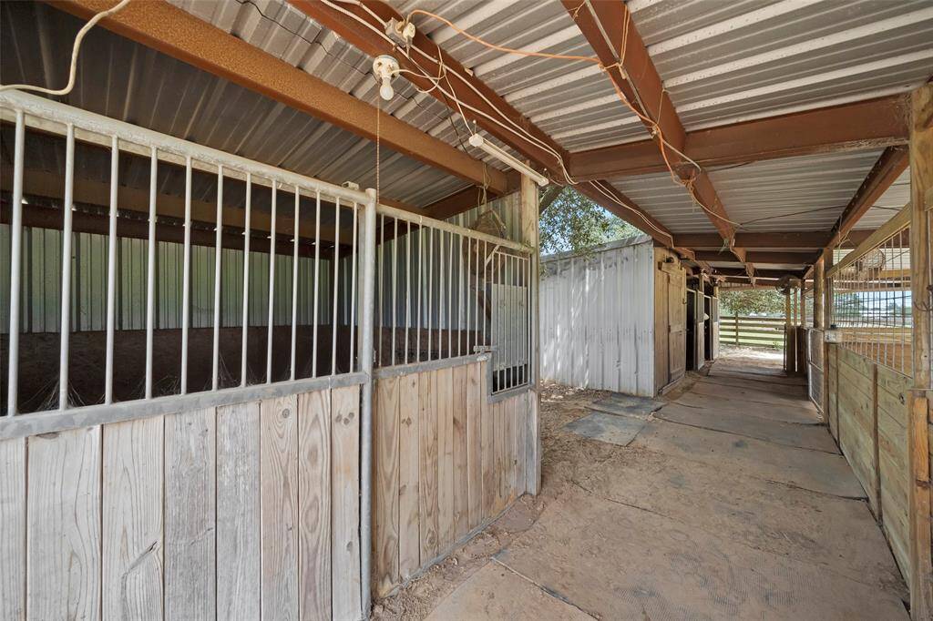 A wide center aisle makes feeding, grooming, and turnout easy, with direct access to stalls and storage for your gear or feed.