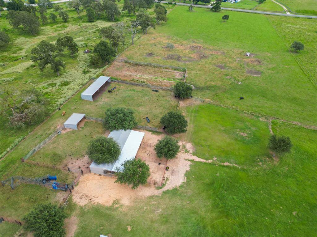 From above, you can see the well-planned layout of the arena, pens, and loafing sheds—ready for personal use. Whether you're saddling up for a solo ride or turning out your horses, it’s all set up for a laid-back, private routine.