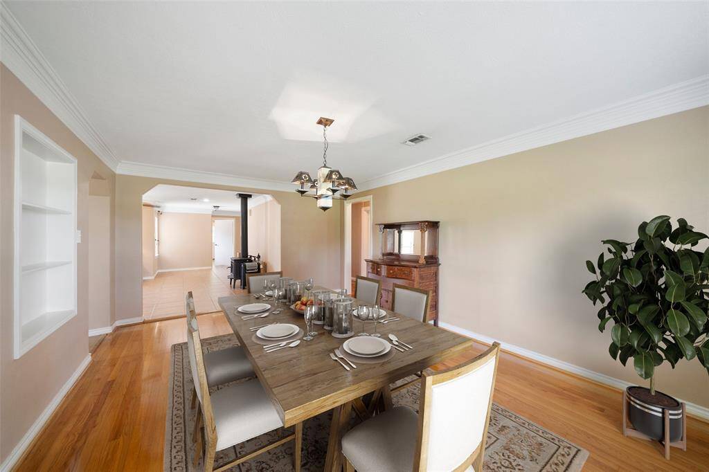 Virtually staged to show how this elegant dining space can come to life—ideal for cozy meals or special occasions with guests.