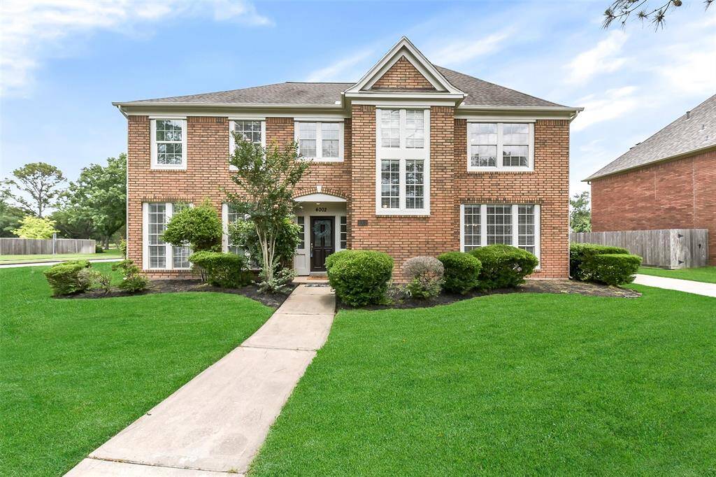 LOCATED ON A LARGE CORNER LOT