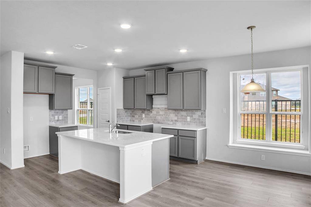 The Princeton- Kitchen. Home under construction. Sample floor plan photo used for illustrative purposes only. Upgrades, selections options, windows and colors may vary.