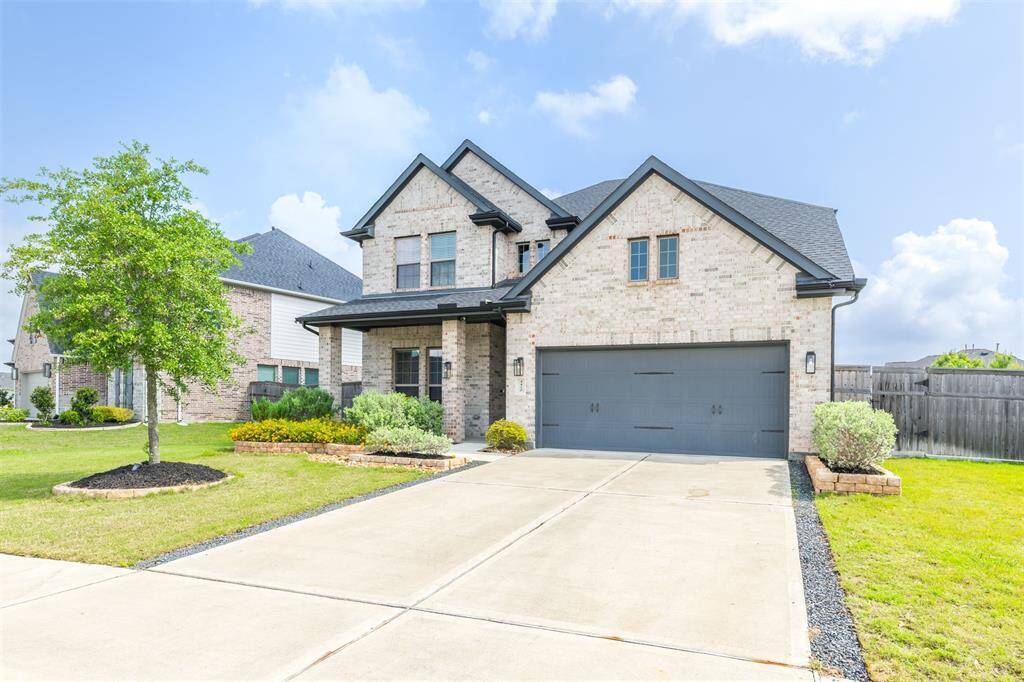 Stunning brick exterior with a two-car garage, double wide driveway, epoxy garage floor and gorgeous landscaping with stone surround. This beautiful home offers fantastic curb appeal.