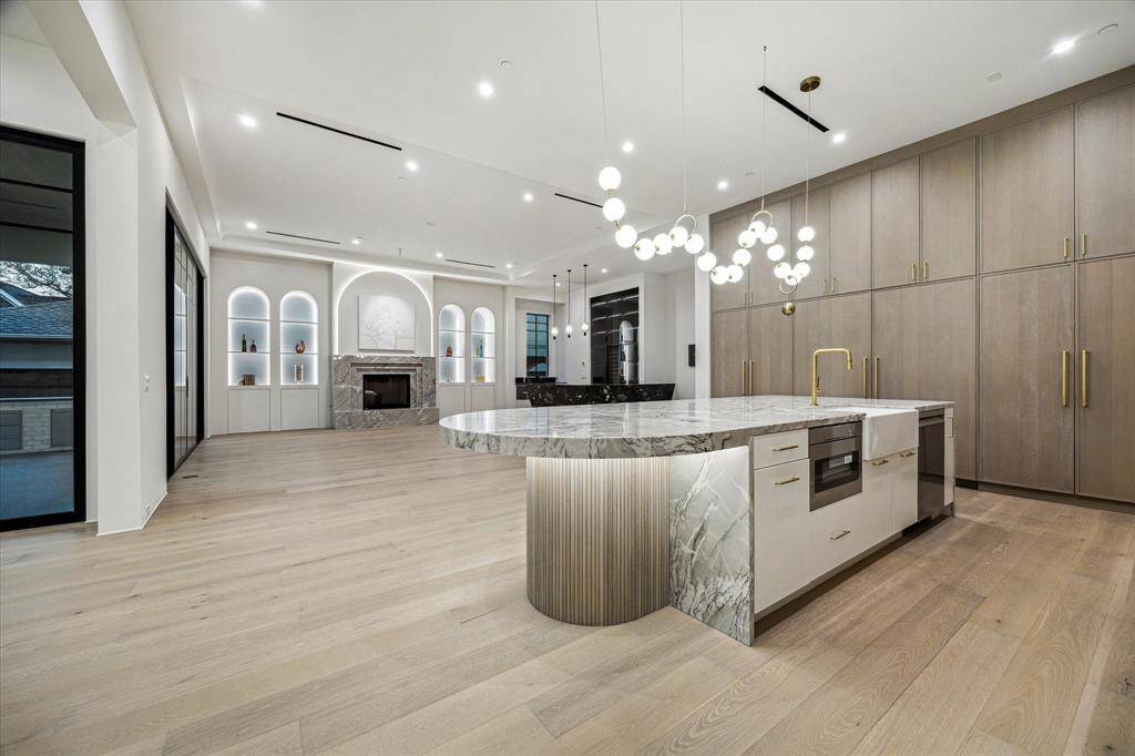 All the downstairs common area AC registers are linear for a clean look and cross blade in other areas. All return air grills are custom made wood louver.
