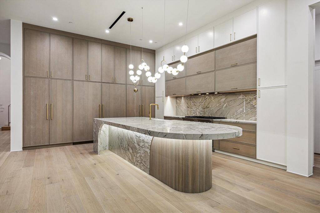 All cabinetry in the house was custom designed and manufactured. The floor to ceiling sets in the Kitchen are finely fitted.