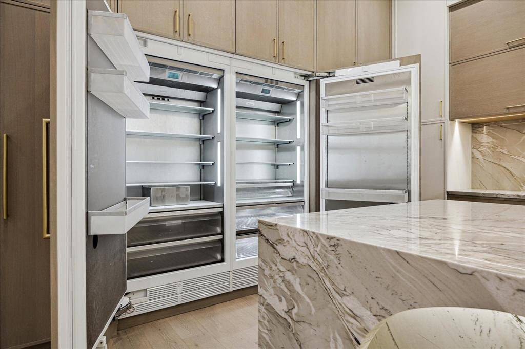 The adjacent two sets contain the Thermador refrigerator and Freezer,