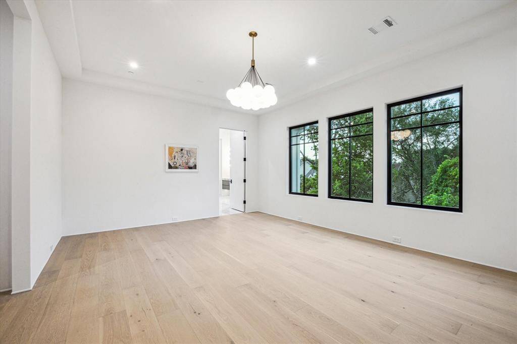 The Primary bedroom has three large windows for good northern light. The European oak floors follow through all the bedrooms.(SEE the Floor Plan)