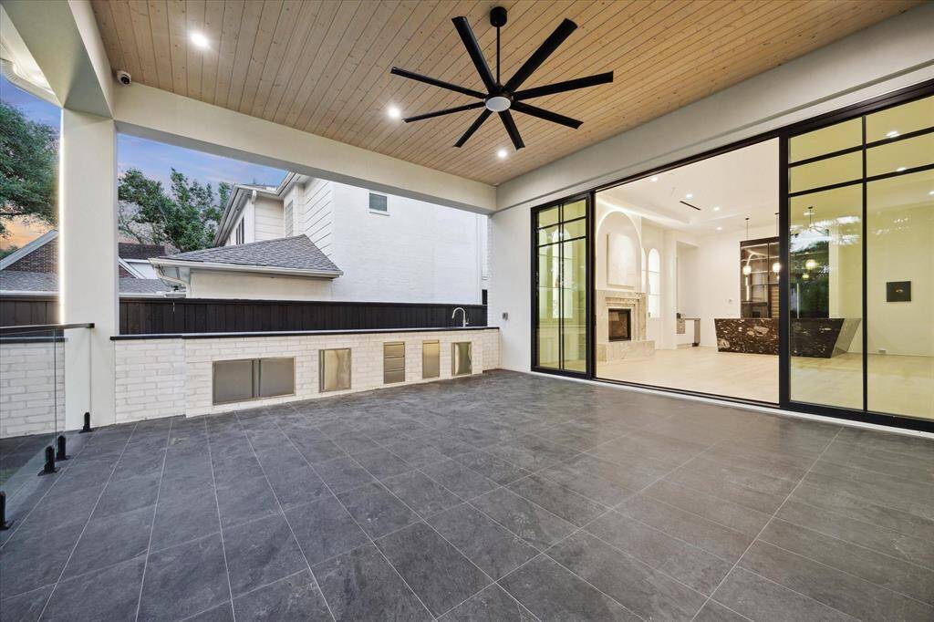 The outdoors are shared with the indoors both visually and from the wide doors to the spacious covered patio.
