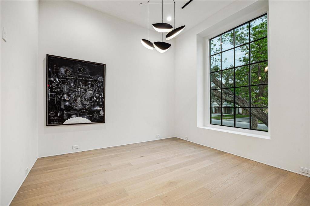 The Study has a proprietary view to the front of the house from a large window. Wide-plank engineered European oak flooring here runs through most of the house.