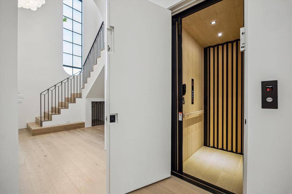 The elevator rises from the garage level to the other two floors. (SEE the Floor Plan)