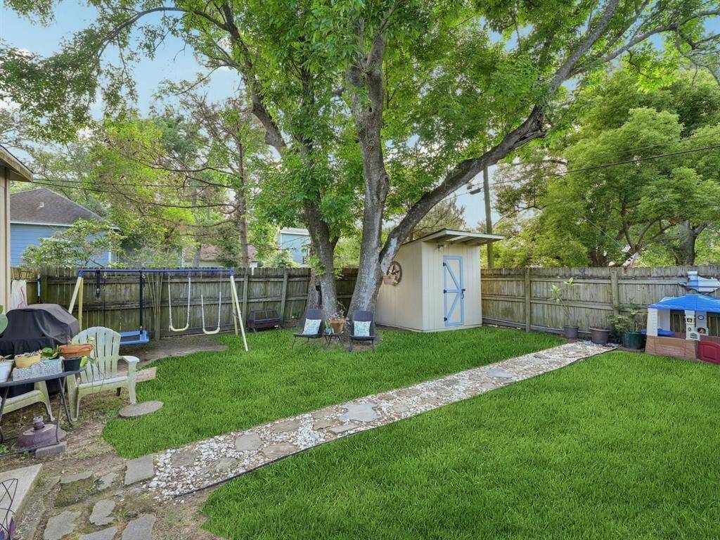 Check out this pretty backyard with a terrific shade tree!