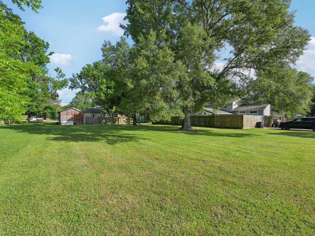 The lot behind the house conveys with the property.