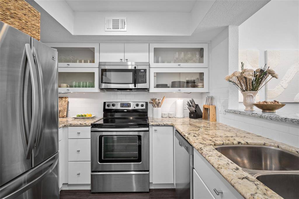 Granite countertops, stainless appliances, and updated cabinets.