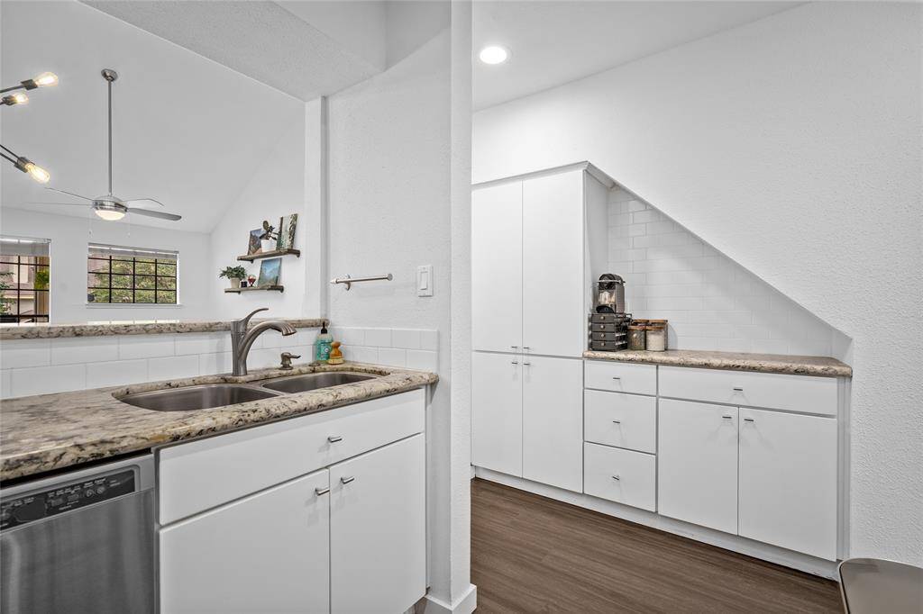 Additional storage space and serving bar off kitchen.