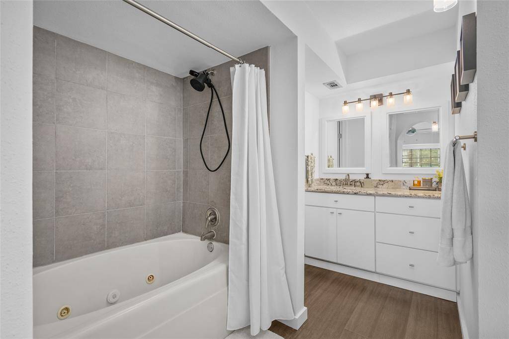 Primary bath with jetted tub and private water closet.