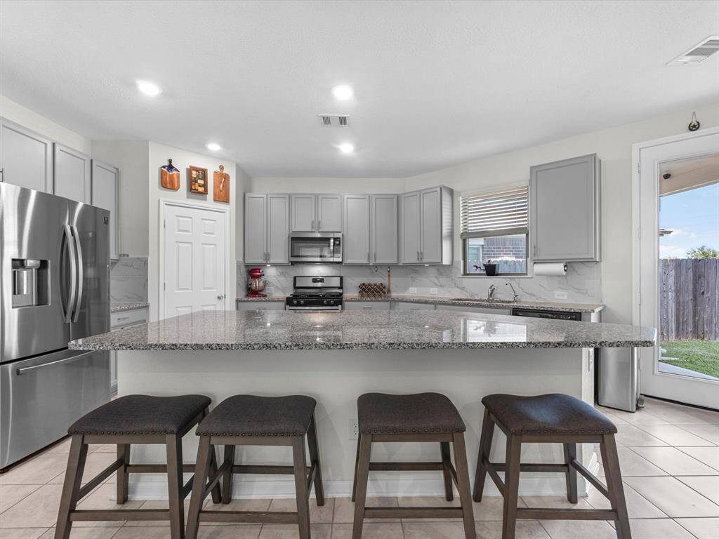 Large kitchen island, anchoring the open concept space