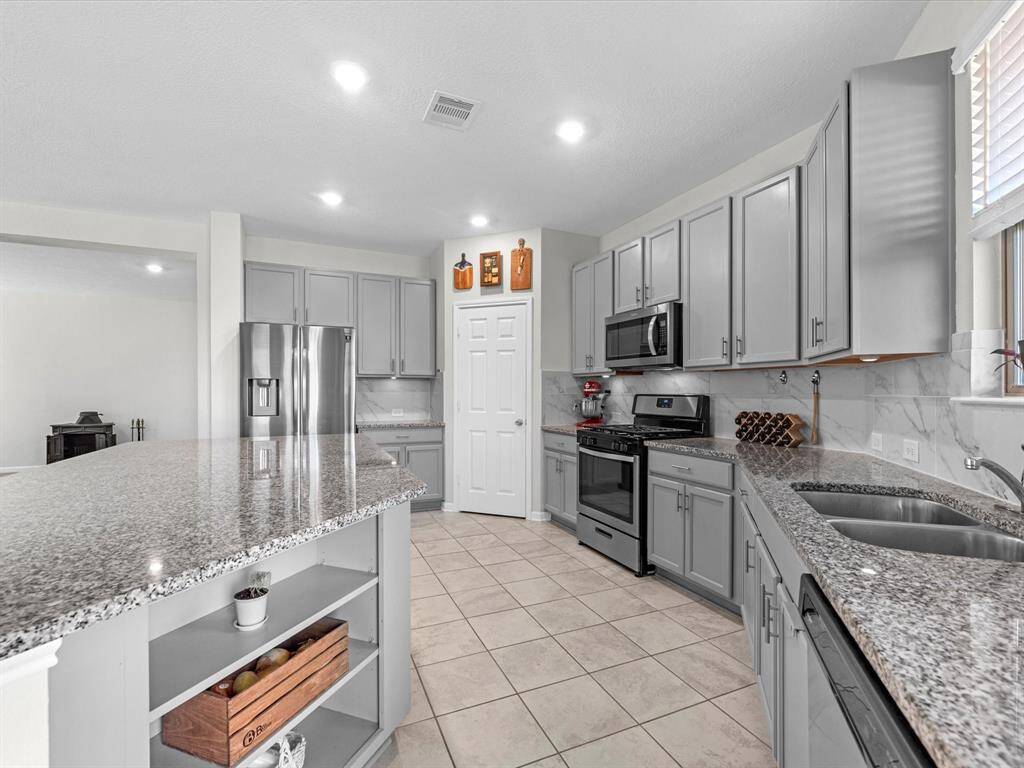 Ample cabinetry and granite surfaces