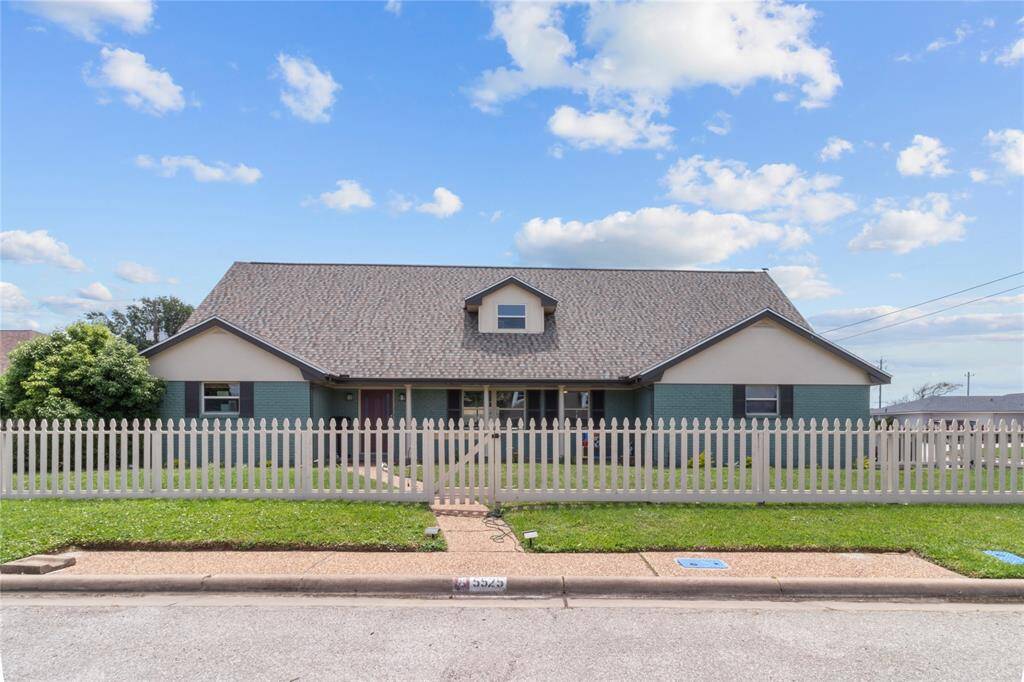 Charming single-story home with a gabled roof and inviting front porch. Features a fenced yard and well-maintained landscaping. Ideal for families seeking a cozy residence in a pleasant neighborhood.