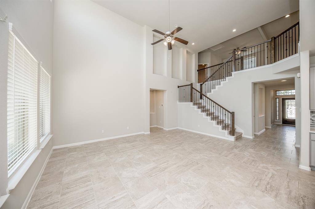 The kitchen opens into this large and airy living space.