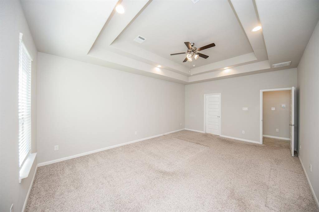 This gorgeous primary bedroom is on the first floor.
