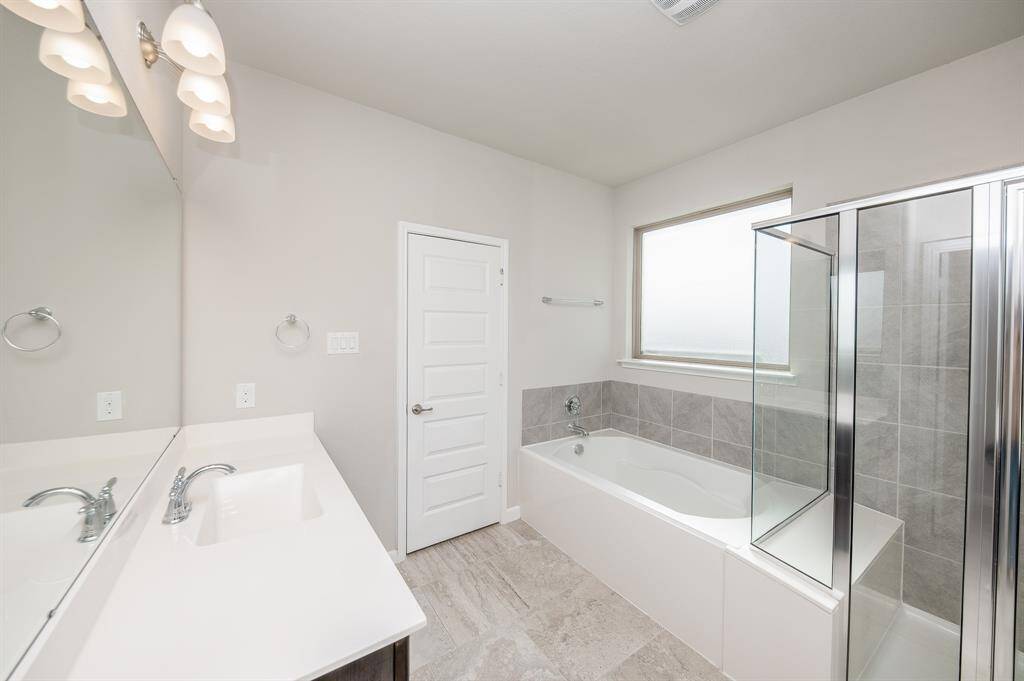 You also get a beautiful garden tub and a separate shower.