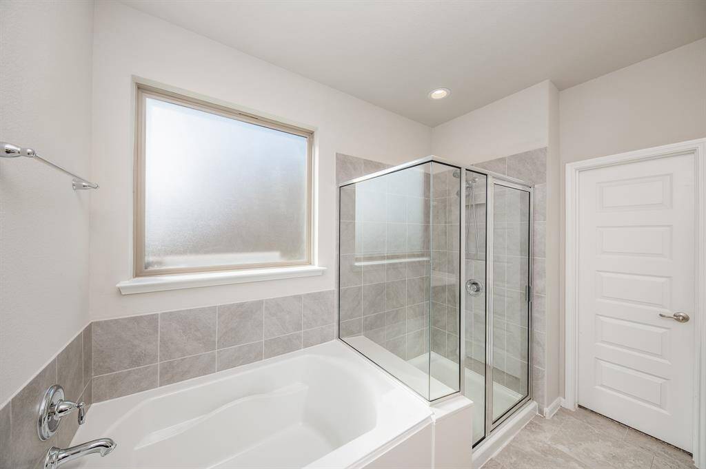Notice the privacy glass just above the tub.