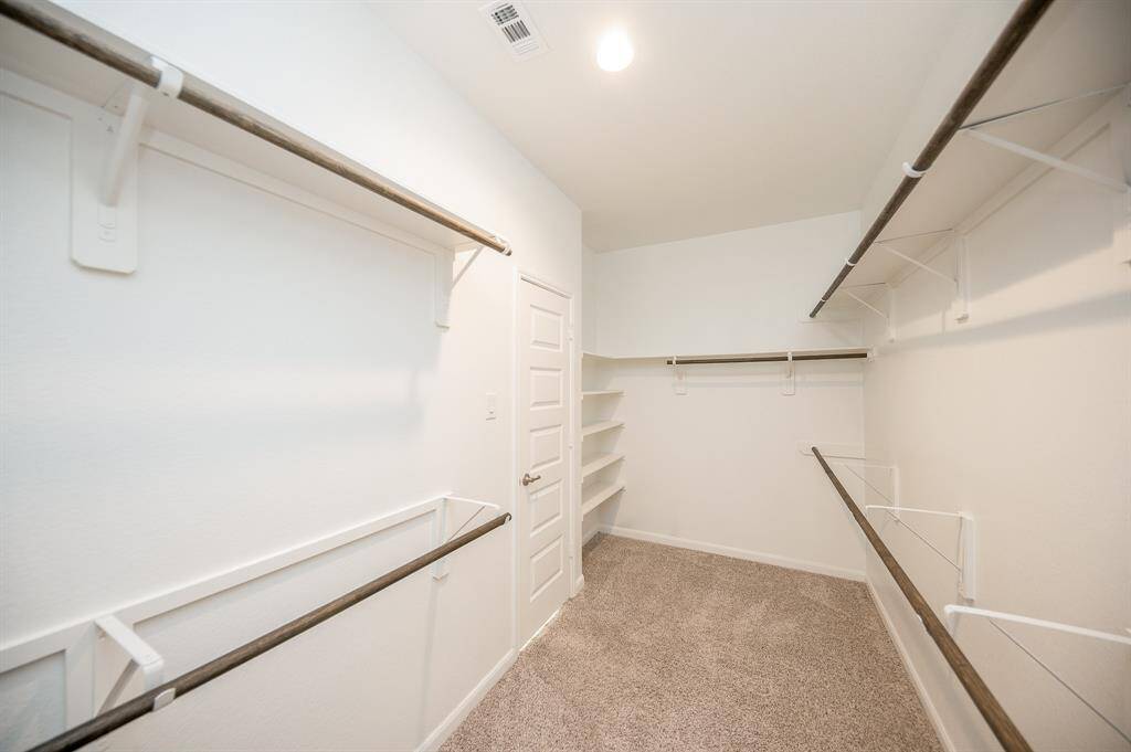 This large primary closet just off of the bathroom.