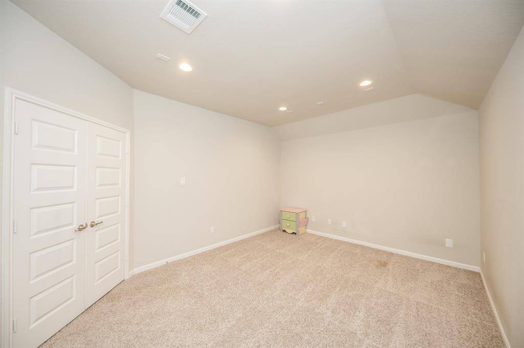 One of the secondary bedrooms.This space is perfect for a Queen bedroom set.