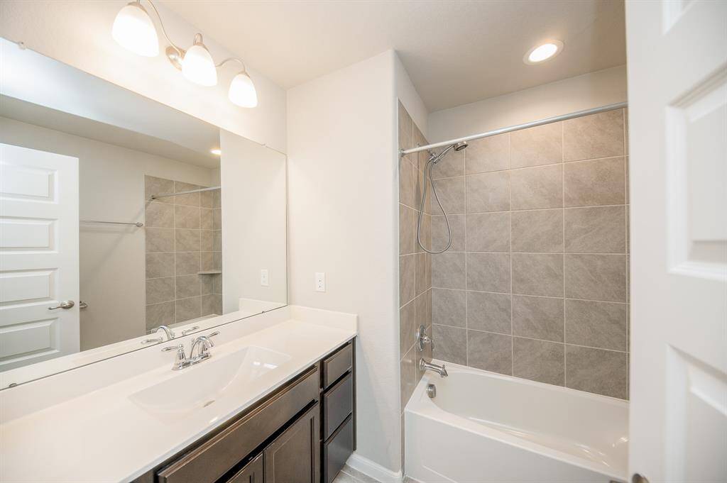 This secondary bathroom is like new.