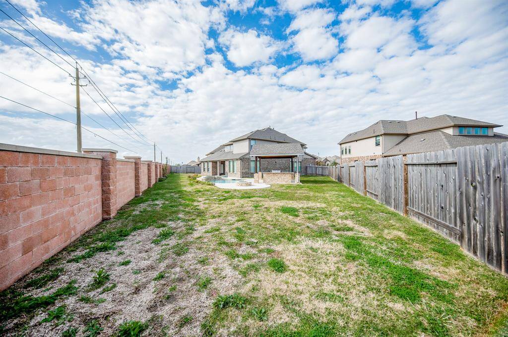 This huge lot still has plenty of room for a backyard football game.