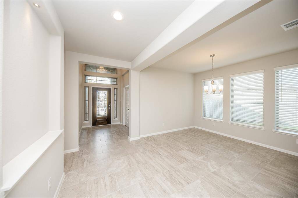 To the left of the entry is a formal dining area.