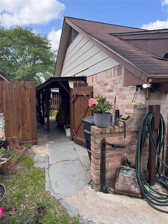 Walkway on the left side of the home