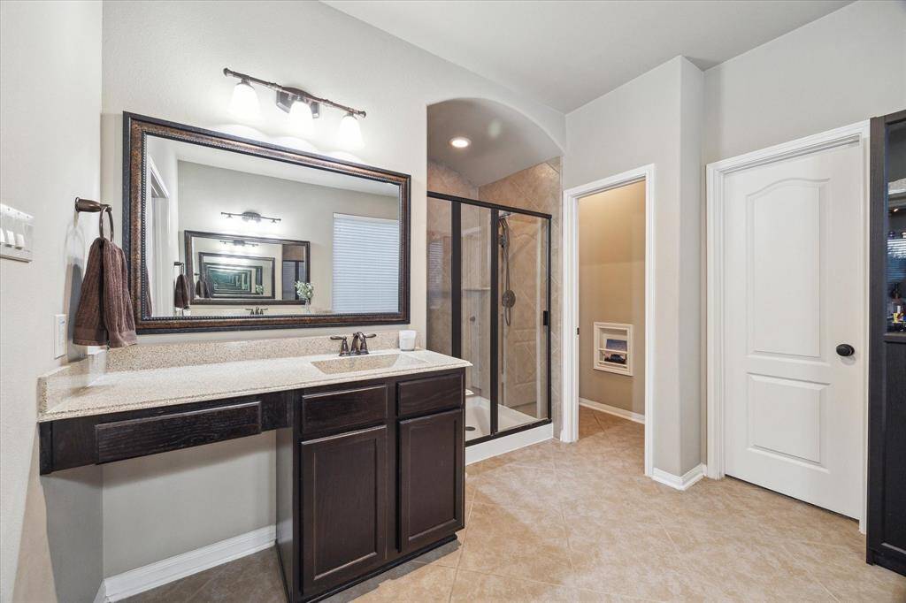 Live in luxury with the large walk-in shower in the primary en suite bathroom.