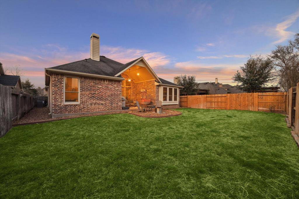 Invite your friends for a backyard celebration in this private and well-designed outdoor space with professionally landscaped yard and enviable brick covered patio.