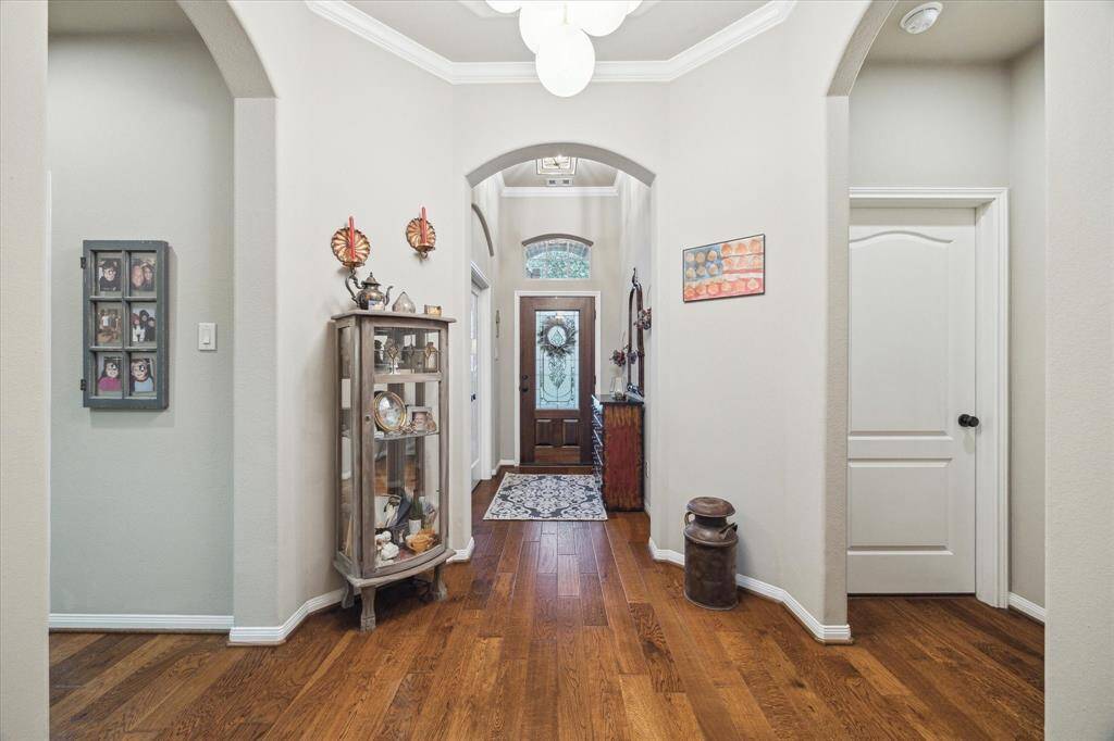 Well-maintained dark hardwoods flow throughout the first floor connecting the living spaces seamlessly.