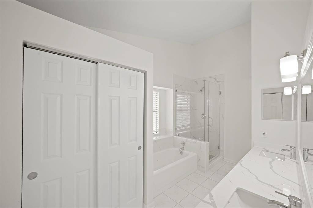 His / Her sinks with separate shower and tub. Large closet space.