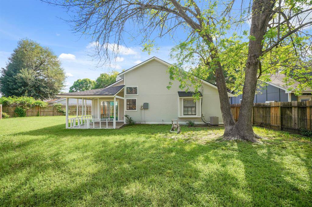 Another angle of the oversized backyard. Tree provides a generous amount of shade.