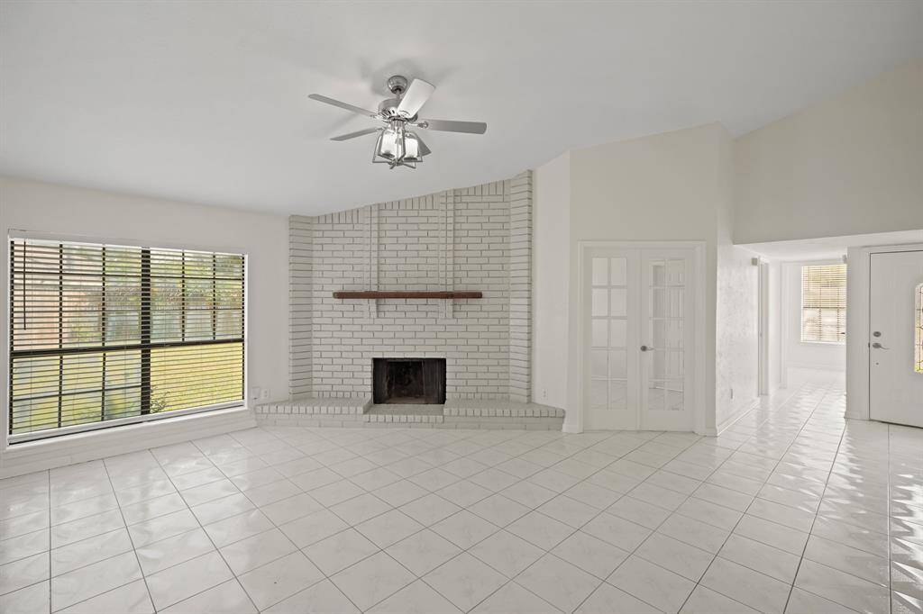 Another view of living room with view of bedroom 1 and bedroom 2