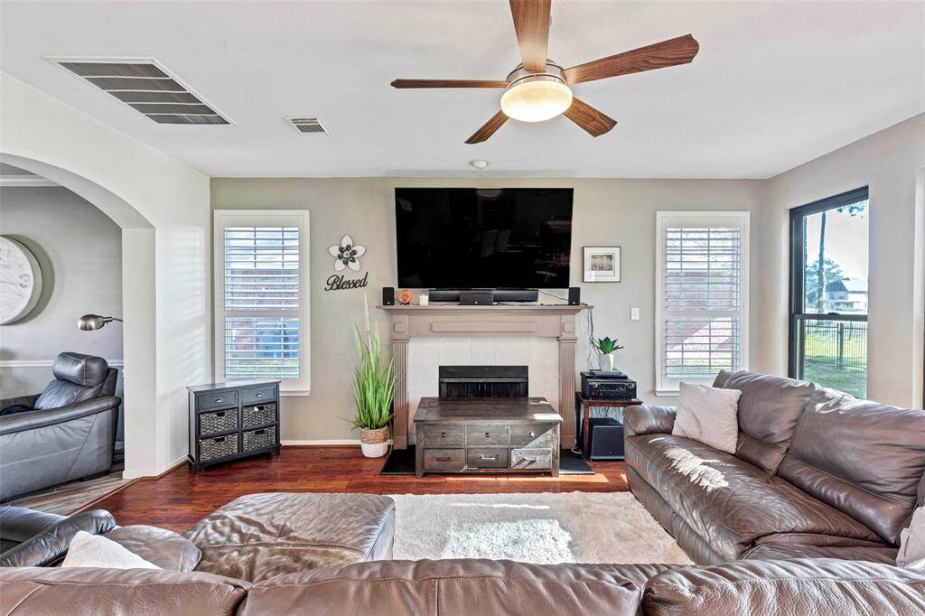 Bright and inviting family room with cozy fireplace.